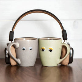 Mugs with stick on eyes and headphones on. Funny and motivational Gift Mugs - GiftyMcGiftFace